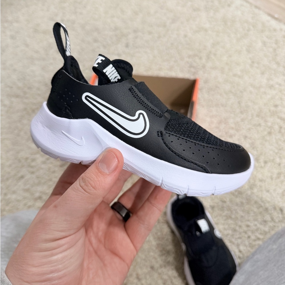 Nike Kids Black and White Slip-On Sneaker with Bold Swoosh